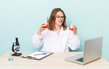 young physician woman with a microscophe. sciencist concept
