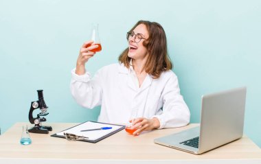 young physician woman with a microscophe. sciencist concept