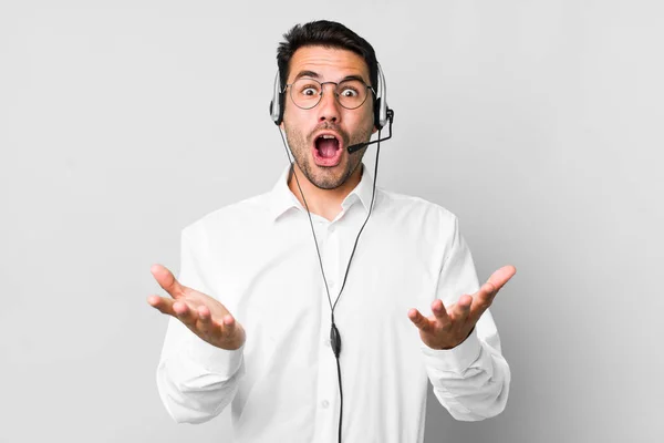 Young Adult Hispanic Man Feeling Extremely Shocked Surprised Telemarketer Concept — Stock Photo, Image