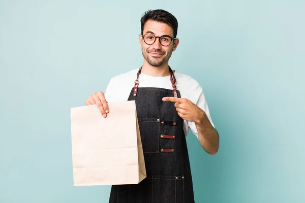 Young Adult Hispanic Man Smiling Cheerfully Feeling Happy Pointing Side — Stock Photo, Image