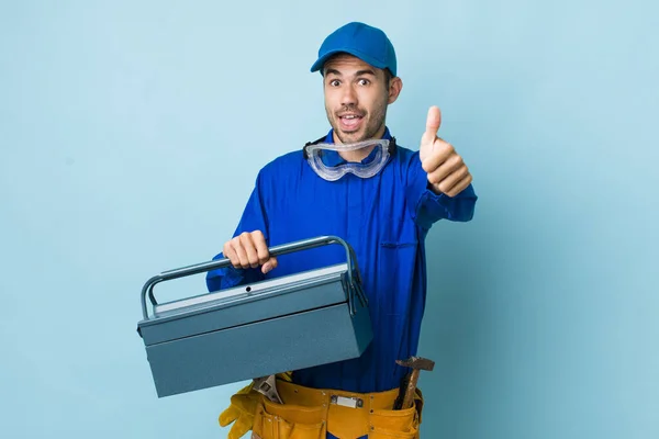 Young Adult Hispanic Man Feeling Proud Smiling Positively Thumbs Toolbox — Foto de Stock