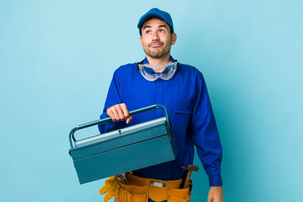 Young Adult Hispanic Man Shrugging Feeling Confused Uncertain Toolbox Concept — Stock Photo, Image