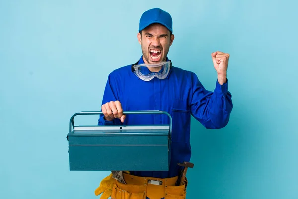 Young Adult Hispanic Man Shouting Aggressively Angry Expression Toolbox Concept — Stockfoto