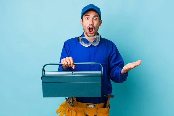 Young Adult Hispanic Man Feeling Extremely Shocked Surprised Toolbox Concept — Stockfoto