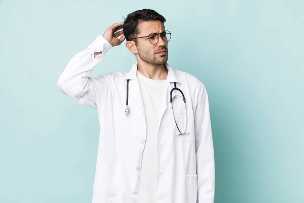 Young Adult Hispanic Man Smiling Happily Daydreaming Doubting Physician Concept — 스톡 사진