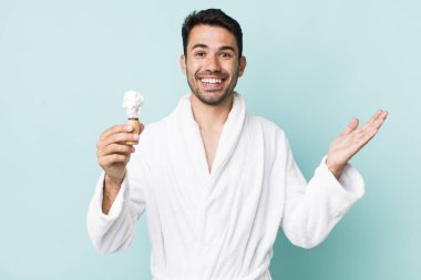 young adult hispanic man feeling happy, surprised realizing a solution or idea. shaving concept