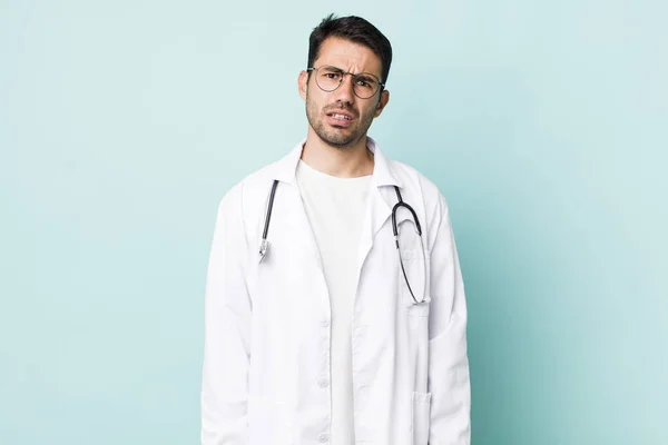 Young Adult Hispanic Man Feeling Puzzled Confused Physician Concept — 스톡 사진