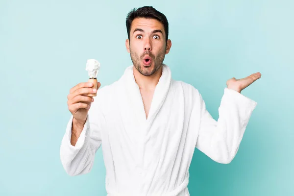 Young Adult Hispanic Man Looking Surprised Shocked Jaw Dropped Holding — Fotografia de Stock