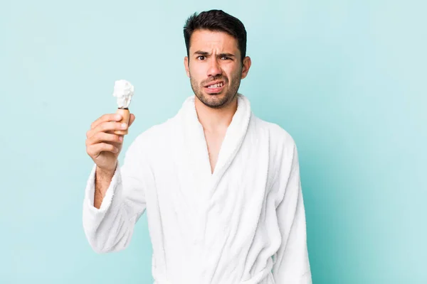 Young Adult Hispanic Man Feeling Puzzled Confused Shaving Concept — Stok fotoğraf