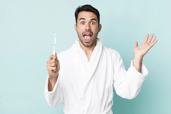 Young Adult Hispanic Man Feeling Happy Astonished Something Unbelievable Toothbrush — Stock fotografie