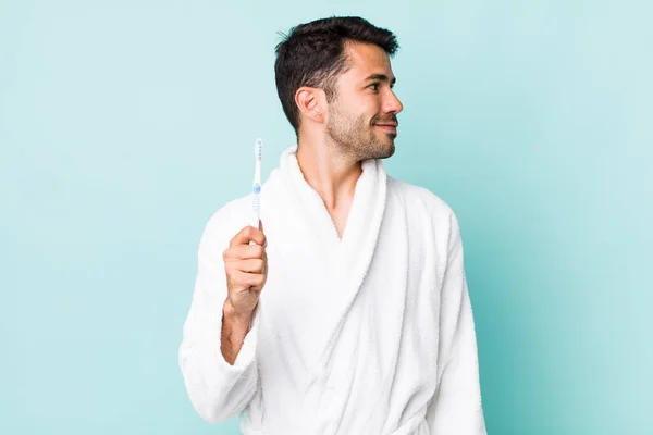 Young Adult Hispanic Man Profile View Thinking Imagining Daydreaming Toothbrush — Stock fotografie
