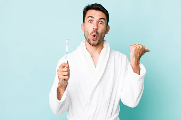 Young Adult Hispanic Man Looking Astonished Disbelief Toothbrush Concept — Stok fotoğraf