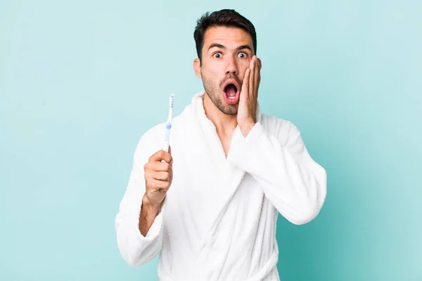 Young Adult Hispanic Man Feeling Shocked Scared Toothbrush Concept — Stockfoto