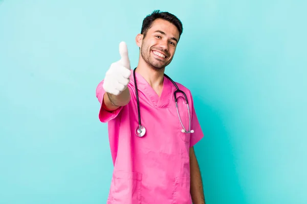 Young Adult Hispanic Man Feeling Proud Smiling Positively Thumbs Veterinarian — Zdjęcie stockowe