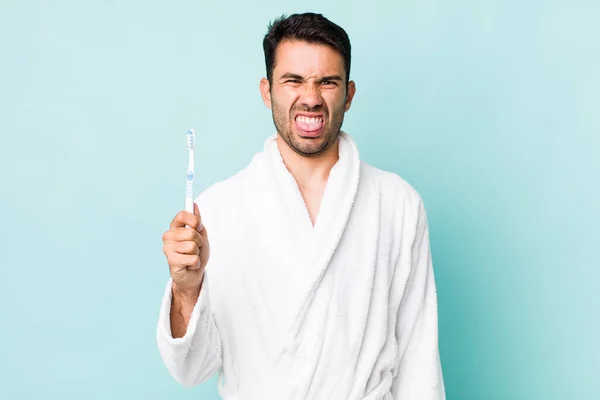 Young Adult Hispanic Man Feeling Disgusted Irritated Tongue Out Toothbrush — Stock fotografie