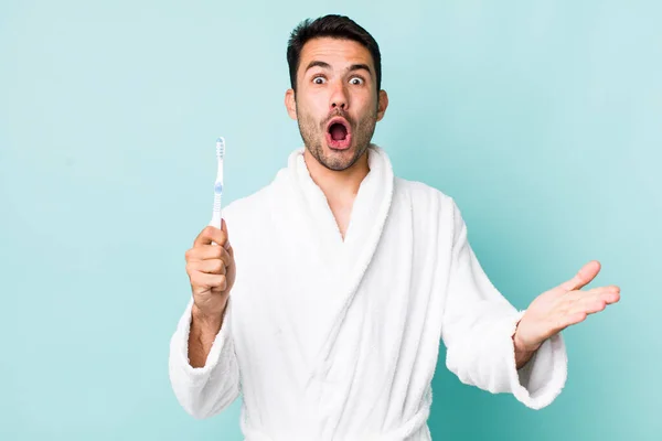 Young Adult Hispanic Man Feeling Extremely Shocked Surprised Toothbrush Concept — Stock fotografie