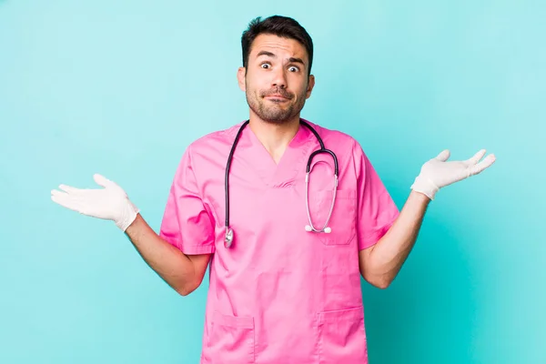 Young Adult Hispanic Man Feeling Puzzled Confused Doubting Veterinarian Concept — 图库照片