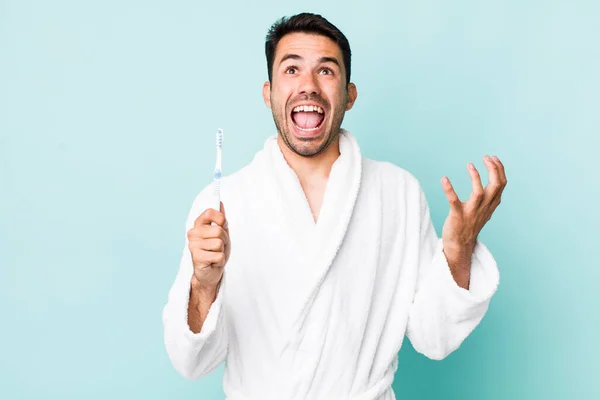 Young Adult Hispanic Man Looking Desperate Frustrated Stressed Toothbrush Concept — Stok fotoğraf