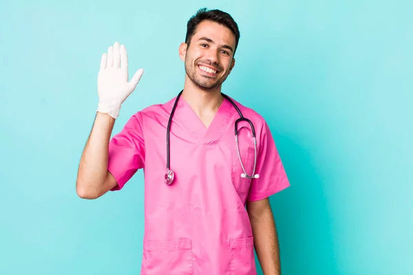 Young Adult Hispanic Man Smiling Happily Waving Hand Welcoming Greeting —  Fotos de Stock