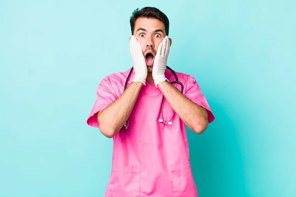 Young Adult Hispanic Man Feeling Shocked Scared Veterinarian Concept — Stok fotoğraf