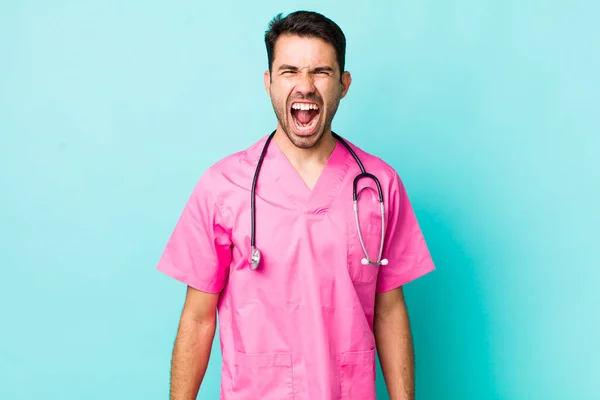 Young Adult Hispanic Man Shouting Aggressively Looking Very Angry Veterinarian — Stockfoto