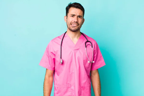 Young Adult Hispanic Man Looking Puzzled Confused Veterinarian Concept —  Fotos de Stock
