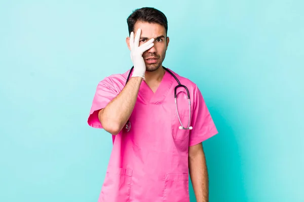 Young Adult Hispanic Man Feeling Bored Frustrated Sleepy Tiresome Veterinarian — Stockfoto