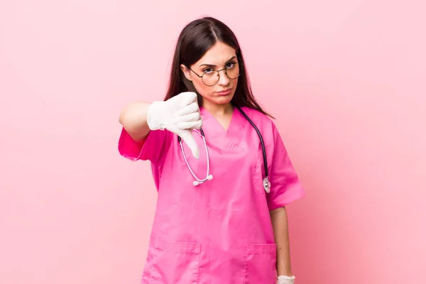 Young Pretty Woman Feeling Cross Showing Thumbs Veterinarian Concept — Stockfoto