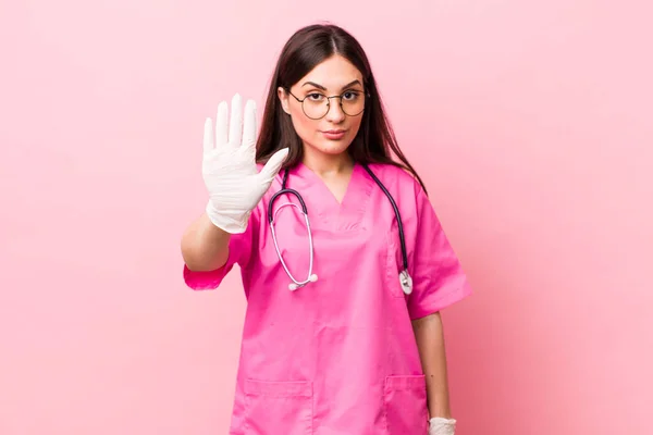 Young Pretty Woman Looking Serious Showing Open Palm Making Stop — Stok fotoğraf