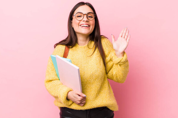 young pretty woman feeling happy and astonished at something unbelievable. university student concept