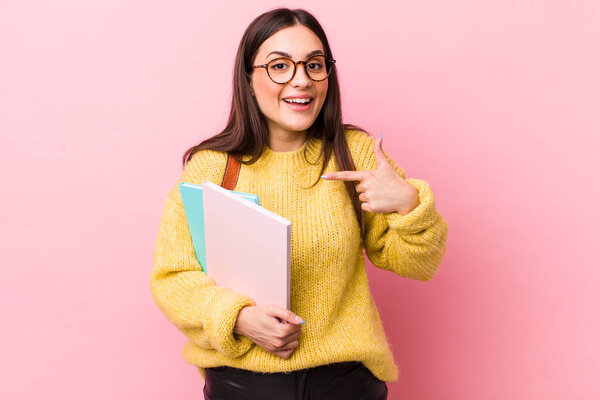 young pretty woman feeling happy and pointing to self with an excited. university student concept