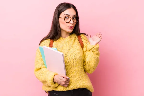 Young Pretty Woman Looking Surprised Shocked Jaw Dropped Holding Object — 图库照片