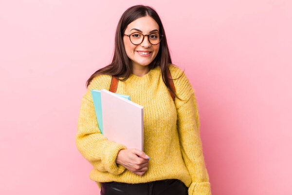 young pretty woman looking happy and pleasantly surprised. university student concept