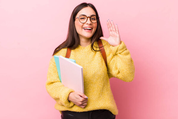 young pretty woman screaming with hands up in the air. university student concept