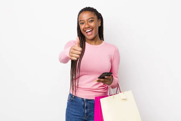 Young Adult Black Woman Feeling Proud Smiling Positively Thumbs Shopping —  Fotos de Stock