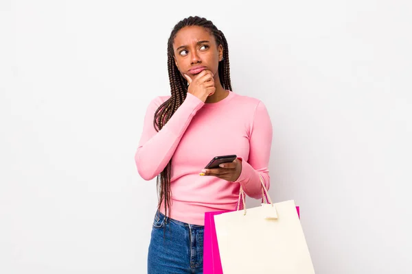 Young Adult Black Woman Thinking Feeling Doubtful Confused Shopping Bags — Fotografia de Stock