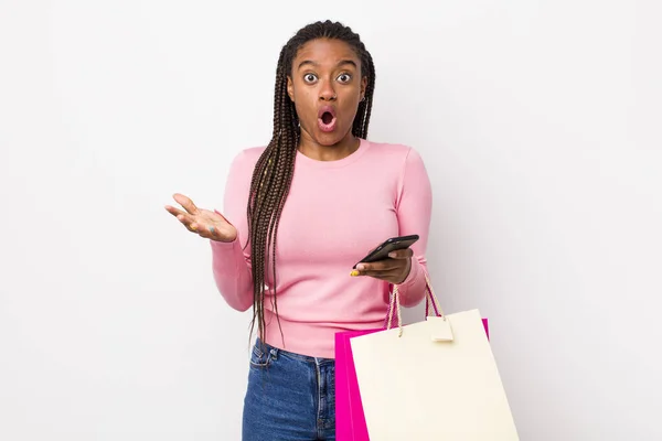 Young Adult Black Woman Feeling Extremely Shocked Surprised Shopping Bags — Stockfoto