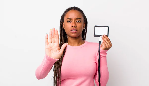 Young Adult Black Woman Looking Serious Showing Open Palm Making — Fotografia de Stock