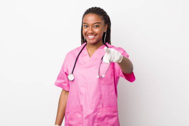 young adult black woman pointing at camera choosing you. veterinarian concept