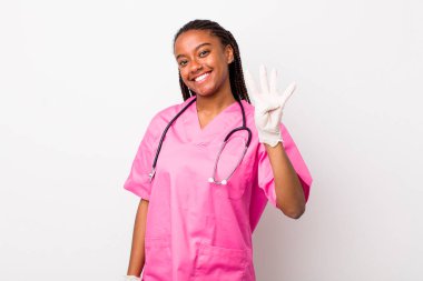 young adult black woman smiling and looking friendly, showing number four. veterinarian concept