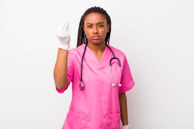 young adult black woman making capice or money gesture, telling you to pay. veterinarian concept