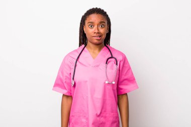young adult black woman looking puzzled and confused. veterinarian concept