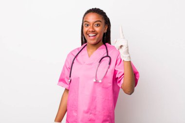 young adult black woman feeling like a happy and excited genius after realizing an idea. veterinarian concept