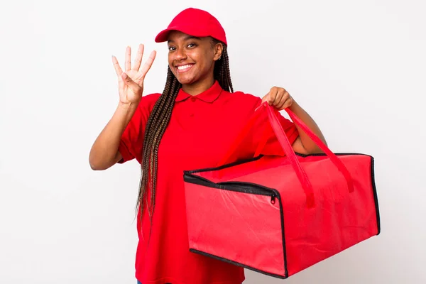 Young Adult Black Woman Smiling Looking Friendly Showing Number Four — Stockfoto