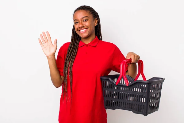 Young Adult Black Woman Smiling Happily Waving Hand Welcoming Greeting — Foto Stock