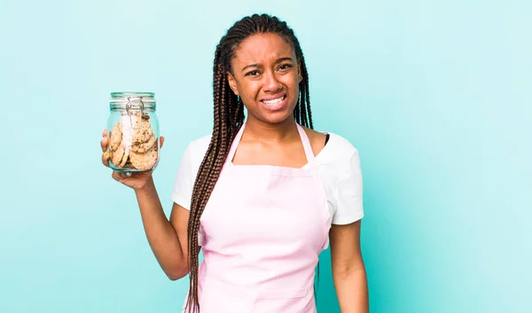 Young Adult Black Woman Feeling Puzzled Confused Home Made Cookies —  Fotos de Stock