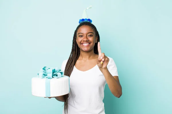 Young Adult Black Woman Smiling Looking Friendly Showing Number One — Fotografia de Stock