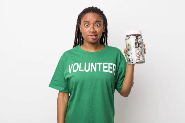 Young Adult Black Woman Looking Puzzled Confused Volunteer Donation Concept — Stok fotoğraf