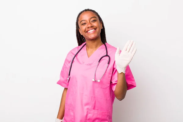 Young Adult Black Woman Smiling Happily Waving Hand Welcoming Greeting — Stock Photo, Image