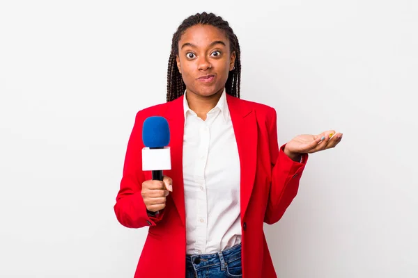 Young Adult Black Woman Feeling Puzzled Confused Doubting Presenter Microphone — Stockfoto